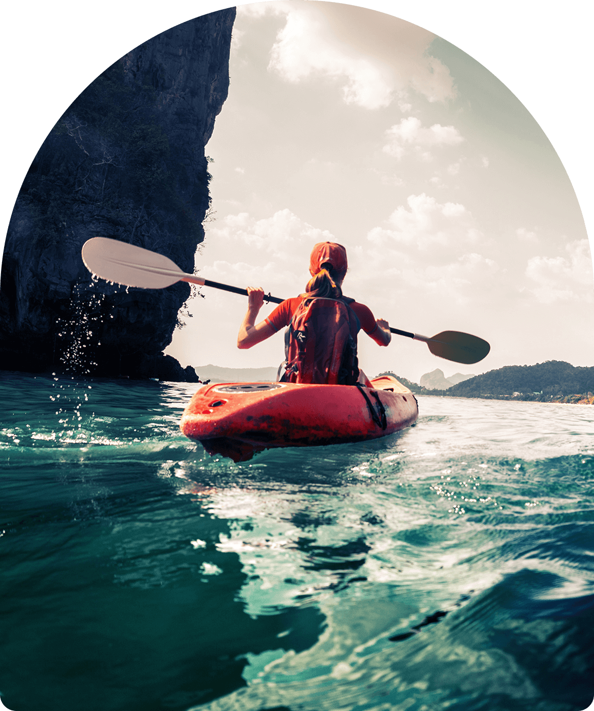Person kayaking on a sunny day.